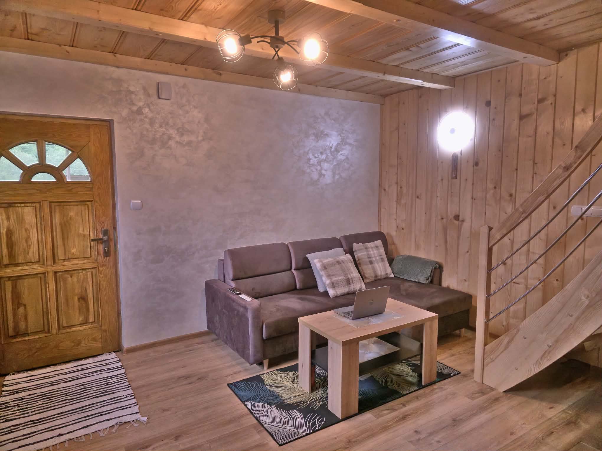Living room with stairs to the loft